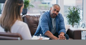 A man consulting his Mental Health Services concerns with a therapist