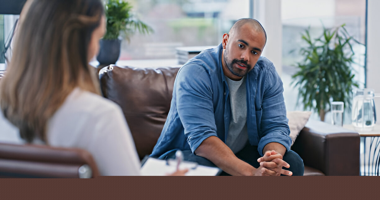 A man consulting his Mental Health Services concerns with a therapist