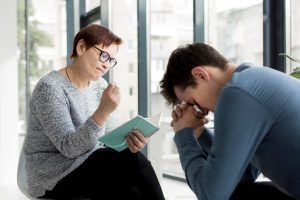 Patient consulting a therapist before enroling to PHP for depression