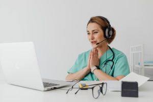 Patient dealing with anxiety consulting to therapist through telehealth therapy