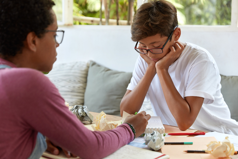 Teen with OCD in a counseling with a psychotherapist