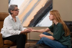 Therapist conducting grounding techniques with a patient