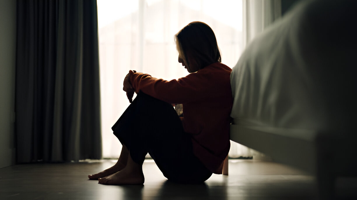 Woman with depression isolating in her room and neeeds the right therapist for depression