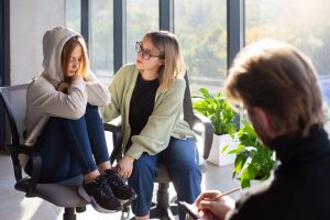 Young adult in a therapy session discussing her depression Intensive Outpatient Therapy