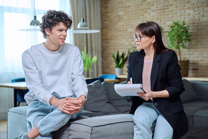 Young man explaining his current situation to a psychotherapist